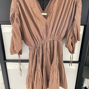 Beige 3/4 sleeve length mini dress.